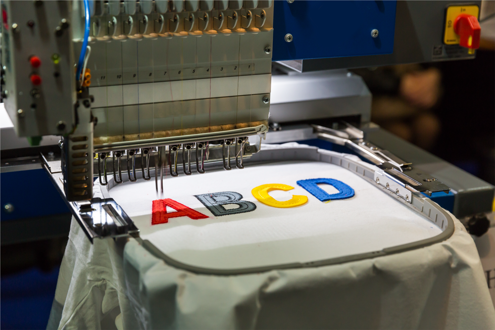 Custom precision embroidery lettering on garments