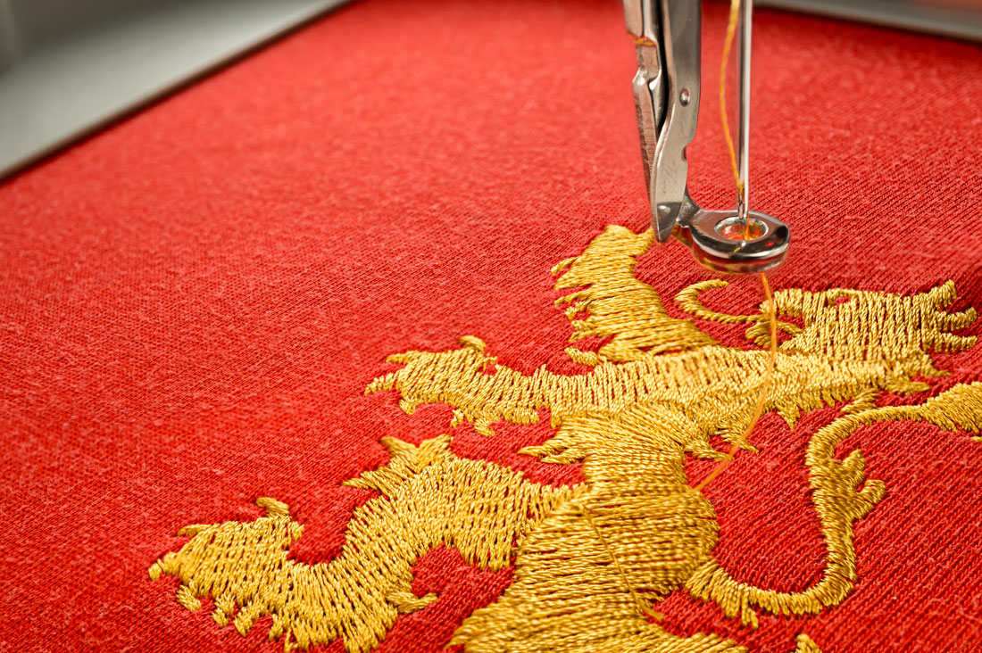 High-density commercial embroidery stitching on fabric by Full Speed 100